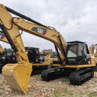 Excavatrice CAT 323D d'occasion de 23 tonnes en bon état pour travaux de terrassement en montagne, construction de logements et gros travaux de terrassement