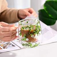 Tasse à double couche en verre borosilicaté à haute teneur en borosilicate Tasse à jus domestique résistante à la chaleur avec un design simple pour les fêtes