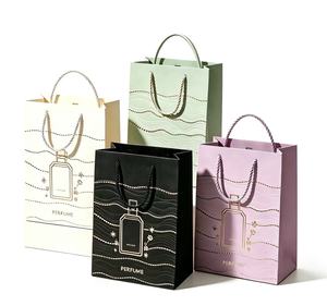Luxury Perfume Gift Paper <b>Bags</b> With Twisted Rope Handles Hot Stamping Offset Printing Reusable Standard Flat <b>Bag</b> Cosmetic Use - Product Image 1