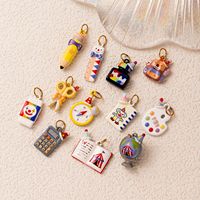 Colgantes de acero inoxidable esmaltados con diseño de dibujos animados Manna, dijes de papelería, lápiz, calculadora para joyería infantil DIY
