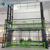 Plateforme élévatrice hydraulique murale à rail de guidage pour le levage de matériaux en entrepôt industriel, capacité lourde 2T