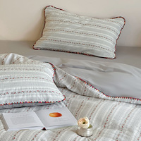 Modernes Bedrucktes Frisches Baumwoll-Jacquard-Bettwäsche-Set mit Dreieckskanten-Design Vierteiliges Bettlaken- und Bettdecken-Set