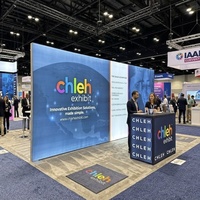 Stand d'exposition IAAPA modulaire 20x20 avec enseigne lumineuse LED rétroéclairée en forme d'arche, panneau mural et comptoir d'accueil