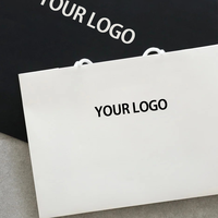 Weiße Umweltfreundliche Papiertüte mit Bandgriff Verstärkter Karton Individuelles Logo Werbe-Einkaufstasche Geschenkverpackung für den Einzelhandel