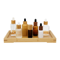 Emballage cosmétique vide en verre avec compte-gouttes en bambou OEM ODM pour sérum, huile essentielle et soins de la peau