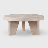 Table basse moderne en marbre travertin, design trépied en pierre naturelle, surface polie pour salon