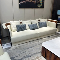 Ensemble de canapés en cuir véritable de luxe italien en forme de U, style moderne et simple, avec placage de bois rouge haut de gamme pour villa.