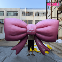 Nœud gonflable personnalisé à suspendre pour la décoration murale des centres commerciaux en extérieur, Nœud gonflable rose pour les événements publicitaires de marque