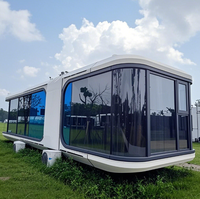 Maison préfabriquée personnalisée, imperméable, résistante à l'humidité, ignifuge, structure en acier, capsule spatiale, maison en forme de pod pour hôtel, boutique, toilettes