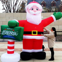 Père Noël géant avec logo gonflable personnalisé Jolly Christmas Figure pour la décoration du centre commercial et les promotions des fêtes