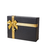 Boîte cadeau rectangulaire écologique noire et or avec ruban à nœud, finition mate et gaufrage