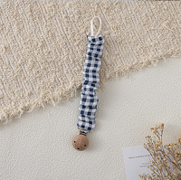 Attache-sucette artisanale en coton mousseline style bohème, motif floral vintage, avec chaîne en bois de hêtre à volants pour bébé