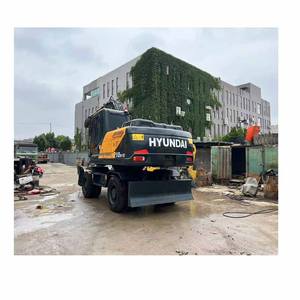 Excavatrice sur pneus Hyundai 124W d'occasion de 21 tonnes avec moteur, pompe et benne de 1,2 m³ – Machine avec rapport fourni - Product Image 2