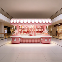 Airy Luxe Bakery & Coffee Market Stall Featuring Glass Display Case, Open Tiered Shelving, and Integrated Warm Lighting