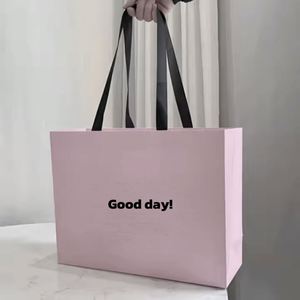 Free Sample Gift <b>Wrapping</b> <b>Paper</b> Bag Clothing Shopping Bag Custom Gift <b>Paper</b> Bags with Handles - Product Image 2