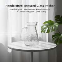 Vente en gros à l'international : Carafe transparente à motif martelé avec poignée, grande capacité, résistante à la chaleur, pour thé, café, jus, usage festif