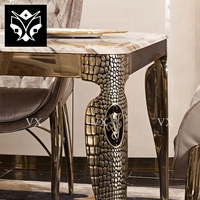 Ensemble de table à manger moderne avec plateau en marbre artificiel et pieds en acier inoxydable au design unique