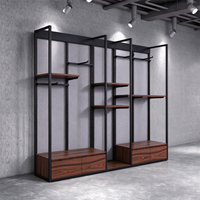 Présentoir de vêtements en métal noir avec logo personnalisé pour magasin de vêtements pour hommes, support de présentation de costumes pour hommes, présentoir de vêtements de vente au détail