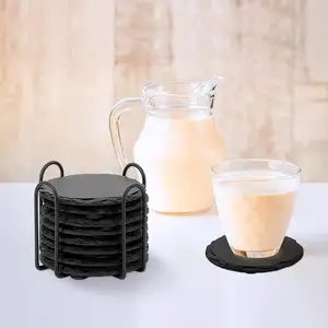 Set pabrikan dari 6 tatakan batu tulis bulat hitam dengan tatakan batu penyangga logam untuk penggunaan minuman di rumah