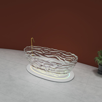 Baignoire autoportante portable en résine cristalline faite à la main avec un design sculpté tendance pour la salle de bain