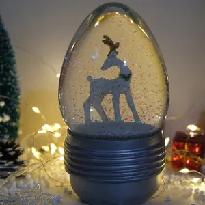 Palla di neve di natale palla di vetro ovale ornamento ago di pino albero di natale palla di cristallo globo di neve