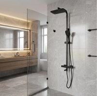 Ensemble de robinetterie de bain et de douche moderne en acier inoxydable noir mat, comprenant une bec de baignoire, une douchette fixée au plafond et une douchette à main