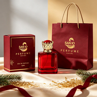 Flacon de parfum en verre transparent rouge de luxe sur mesure OEM 100 ml avec bouchon couronne doré pour maison de parfum de niche en gros