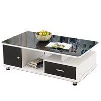 Table basse en bois plaqué noyer avec deux tiroirs latéraux et plateau en verre miroir. Pieds en acier inoxydable chromé.