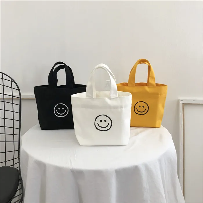 Mini bolso de lona con estampado personalizado, bolsa de compras reutilizable con estampado de cara sonriente, regalo promocional para fiambrera