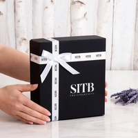 Boîte cadeau noire élégante avec nœud en ruban blanc Emballage de luxe personnalisé Conteneur en papier rigide pour produits de beauté