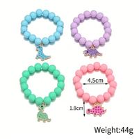 Conjunto de pulsera de color caramelo Popular de cuatro dinosaurios de dibujos animados colgante con cuentas conjunto de pulsera para niños