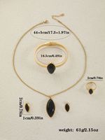 Parure de bijoux en acier inoxydable pour femme, collier pendentif œil de chat de luxe, bracelet, boucles d'oreilles et bague, vente en gros