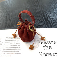 Pochette de rangement cylindrique souple cousue de première qualité avec cordon de serrage pour accessoires d'écouteurs, sac porte-bonheur, porte-monnaie