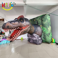 Tête de dinosaure gonflable à décor mural personnalisé avec bouche ouverte et dents pointues