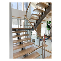 Escalier flottant architectural à monopoutre en acier avec marches en bois