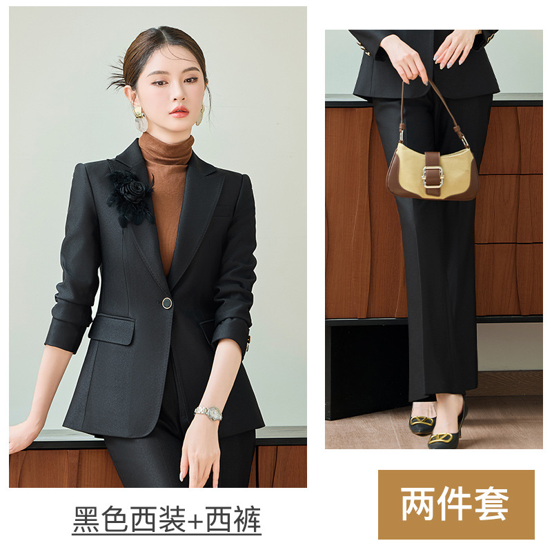 Black suit with flared trousers and a boutonniere