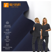 Tissu sergé extensible antibactérien et anti-bouloches en polyester recyclé (72 %), rayonne (21 %) et élasthanne (7 %), 200 g/m²