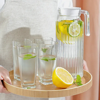 Carafe à eau en plastique PC moderne et écologique de 1100 ml avec poignée et couvercle pour boissons glacées