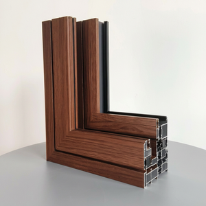 Fenêtre oscillo-battante à finition imitation bois, cadre en aluminium double vitrage, poignée or brossé, vue sur jardin et terrasse - Product Image 4