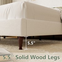 Lit plateforme rembourré noir prêt à être expédié depuis l'entrepôt américain, avec tête de lit ondulée haute et pieds en bois, pour une décoration de chambre moderne