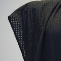 Robe longue ample noire unie en maille texturée à col rond et taille à cordon pour femme