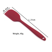 Ensemble d'ustensiles de cuisine en silicone colorés comprenant des spatules, des cuillères à soupe, des fouets à œufs et des accessoires de cuisine