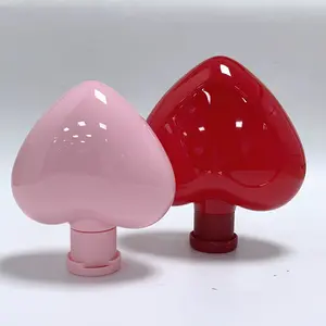 Kozmetik ambalaj cilt bakım ürünleri için özel tasarım plastik boş şişeler vidalı kapak kalp şeklinde şişe