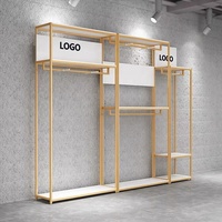 Porte-vêtements mural modulaire en métal noir et or de luxe pour boutique de robes de mariée et magasin de détail