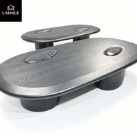 Table basse ovale haut de gamme en placage de bois noir avec incrustation de marbre pour la décoration intérieure de villas de luxe
