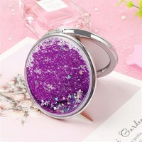 Kustom Logo pribadi Mini lipat bulat kecil tangan cermin dua sisi pasir hisap cair Glitter saku kompak cermin untuk Makeup
