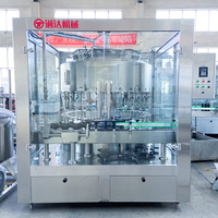 Remplisseuse automatique électrique rotative contrôlée par PLC pour bouteilles en verre de 200 ml avec certification CE pour les boissons moussantes