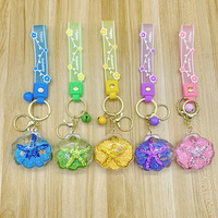 Porte-clés en acrylique en forme d'étoile de mer avec bouteille flottante pour sable mouvant, idéal pour voiture, sac à dos d'étudiant, petit cadeau, ornement suspendu