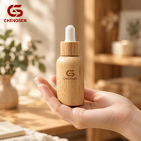 Flacon d'huile essentielle de haute qualité avec couvercle en bambou, verre givré, bouchon à vis, compte-gouttes, 10 ml-100 ml