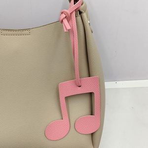 Porte-clés créatif en cuir PU avec breloque musicale, motif note de musique mignon, design léger, accessoire de sac avec sangle de suspension - Product Image 2